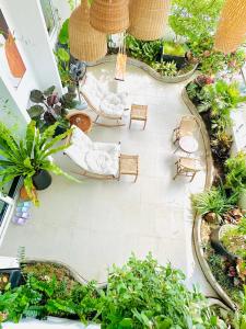 an overhead view of a patio with chairs and plants at Skyline Penthouse Greenery in Ho Chi Minh City