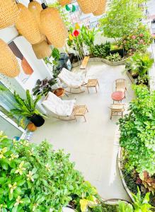 an overhead view of a patio with chairs and plants at Skyline Penthouse Greenery in Ho Chi Minh City