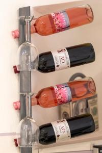 a bunch of wine bottles on a shelf at Romantic-Fireplace-Centrum-Bathtub in Kőszeg