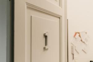 a white door with a number one on it at Sofia's Central Apartment Palermo in Palermo
