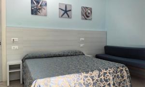Postel nebo postele na pokoji v ubytování Hotel Mirabella
