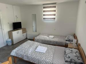 Postel nebo postele na pokoji v ubytování Rooms Enna