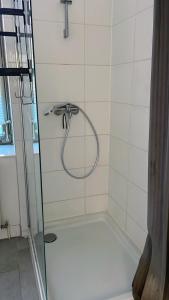 a shower with a hose in a bathroom at L8 Street-Worms in Worms