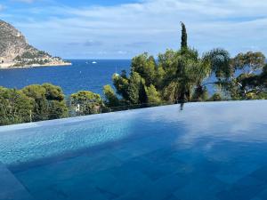 a swimming pool with a view of the ocean at Luxury villa Panoramic Sea View Near Monaco in Éze