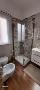 a bathroom with a shower and a toilet and a sink at Relax&Business Velletri Centro in Velletri +14 photos