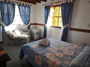 Cama ou camas em um quarto em Hostería Austral