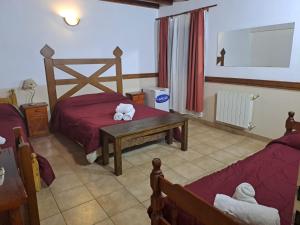 Cama ou camas em um quarto em Hostería Austral