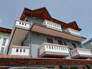 a building with two balconies on top of a roof at Vila Green Relax in Vlorë
