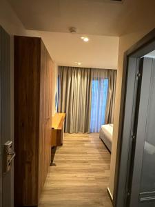 Postel nebo postele na pokoji v ubytování Hotel Utopia