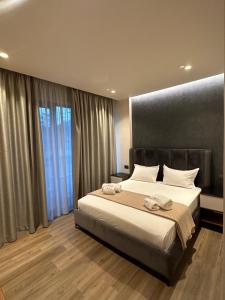 Postel nebo postele na pokoji v ubytování Hotel Utopia