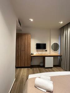 TV a/nebo společenská místnost v ubytování Hotel Utopia