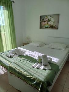 Ένα ή περισσότερα κρεβάτια σε δωμάτιο στο Angelica-Sea & Mountain View