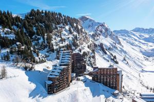 a building in the snow on a snowy mountain at Résidence Antarès - maeva Home - Appartement 2 pièces 4 personnes - Sélection MAE-4214 in Avoriaz