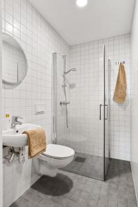 a bathroom with a shower and a toilet and a sink at 7,3sq mts room -Forests cozy house in Stavanger