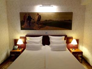 Llit o llits en una habitació de Hotel Mitra, Story Hotels