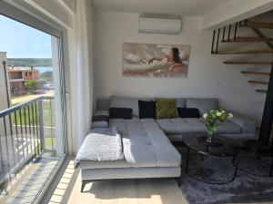 a living room with a couch and a table at Panorama in Medulin