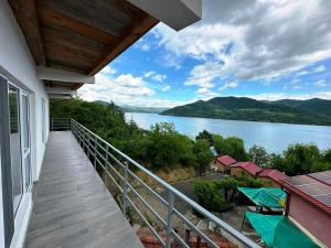 a balcony with a view of a lake at Orsova Gratca 164 in Orşova