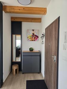 a hallway with a door and a table in a room at Panorama in Medulin