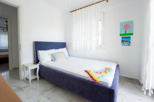 Postel nebo postele na pokoji v ubytování Villa di Μare