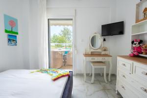 Postel nebo postele na pokoji v ubytování Villa di Μare