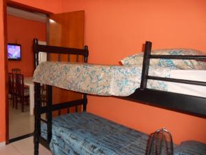 two bunk beds in a room with a mirror at Hostel Tavares Bastos in Rio de Janeiro