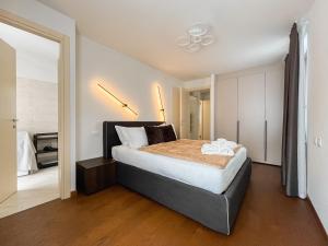 a bedroom with a large bed in a room at Maison Poluc hotel apartments in Champoluc
