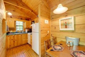 a kitchen with wooden walls and a white refrigerator at Cataloochee Ski Day Trips! Hot Tub Haven in Marion in Marion
