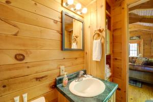 a bathroom with a sink and a mirror at Cataloochee Ski Day Trips! Hot Tub Haven in Marion in Marion +18 photos