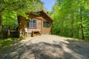 a log cabin in the woods with a large driveway at Cataloochee Ski Day Trips! Hot Tub Haven in Marion in Marion