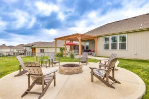 a patio with chairs and a fire pit at Platte City Retreat with Patio, Near Kansas City! in Platte City