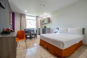 Postel nebo postele na pokoji v ubytování Memora Hotel & Villas Chapala