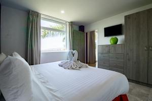 Katil atau katil-katil dalam bilik di Memora Hotel & Villas Chapala