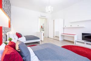 a living room with a couch and a television at Super central convenient apartment in Budapest