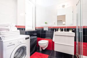 a bathroom with a washing machine and a sink at Super central convenient apartment in Budapest +14 photos