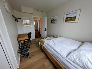 Uma cama ou camas num quarto em The Stykkishólmur Inn by Ourhotels