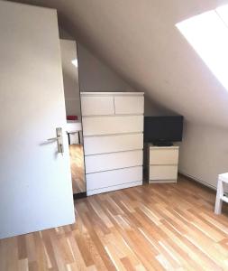 an attic room with a bed and a closet at Privat Zimmer 1 in Zwei-Zimmer-Wohnung als 2er WG in Cologne