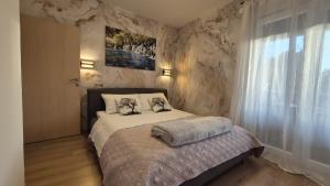 Giường trong phòng chung tại Apartments Adriana +59 ảnh