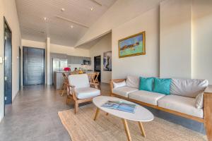 a living room with a couch and a table at La Santa Maria Resort in San Juan del Sur