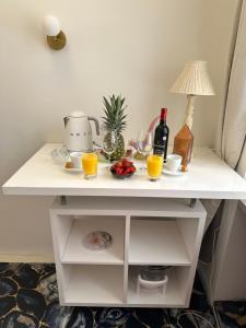 a white table with two glasses of orange juice at La Victoire in Monte Carlo
