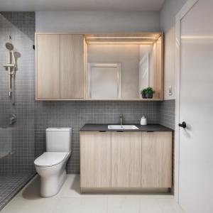a bathroom with a toilet and a sink and a shower at Smithe House in Vancouver