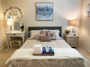 a bedroom with a bed with two towels on it at Bella's sweet house 11155 in Mira Loma