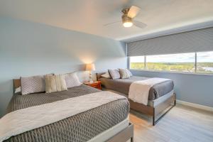 a bedroom with two beds and a window at Views and Pool Access Quaint Condo in Hot Springs! in Hot Springs +23 photos