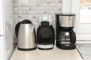a coffee maker and a blender on a counter at Haris Studio 1 in Keramoti
