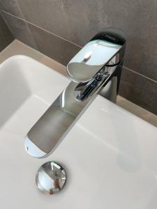 a toaster sitting on top of a white counter at Eliška apartment - modern mountain loft apartment in Ski resort Malino Brdo in Ružomberok +28 photos