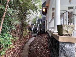 a house with a walkway next to a house at City Lights Retreat on 12th UAB in Birmingham +2 photos
