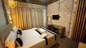 Een bed of bedden in een kamer bij Guest Hotel