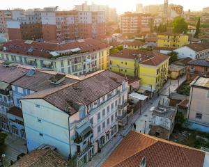 an overhead view of a city with buildings at Gjuhadol stay by Marina in Shkodër