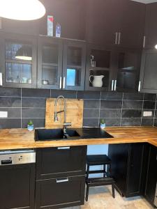a kitchen with a sink and a counter top at Villa Johana in Aucamville +6 photos