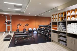 a gym with dumbbells and weights in a room at EVEN Hotel Bozeman Yellowstone Intl Arpt, an IHG Hotel in Belgrade
