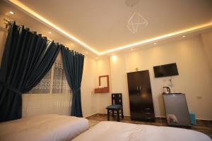Katil atau katil-katil dalam bilik di Happy Day Pyramids View Hotel